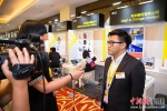 香港利安顾问有限公司的助理建筑设计师李卓辉正在接受中新网记者专访。李南轩 摄 - 福建新闻