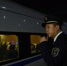 1月14日晚，漳州车务段泉州站的客运值班员林昊在站台上执勤。　庄建华 摄 - 福建新闻